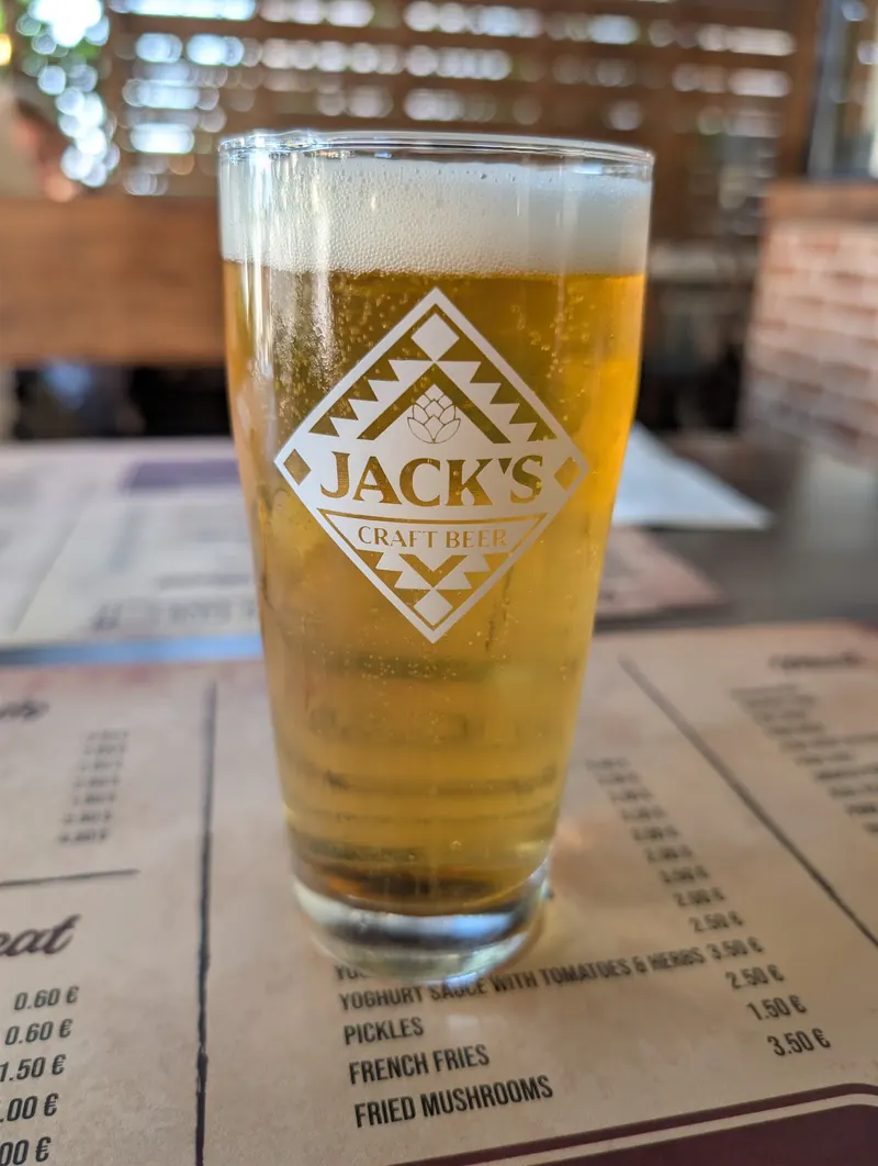 A glass of Jack's craft beer on the table mat